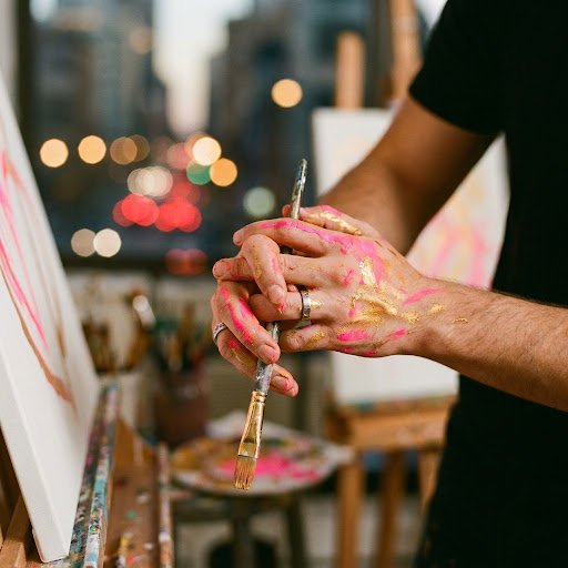 Couple painting hands